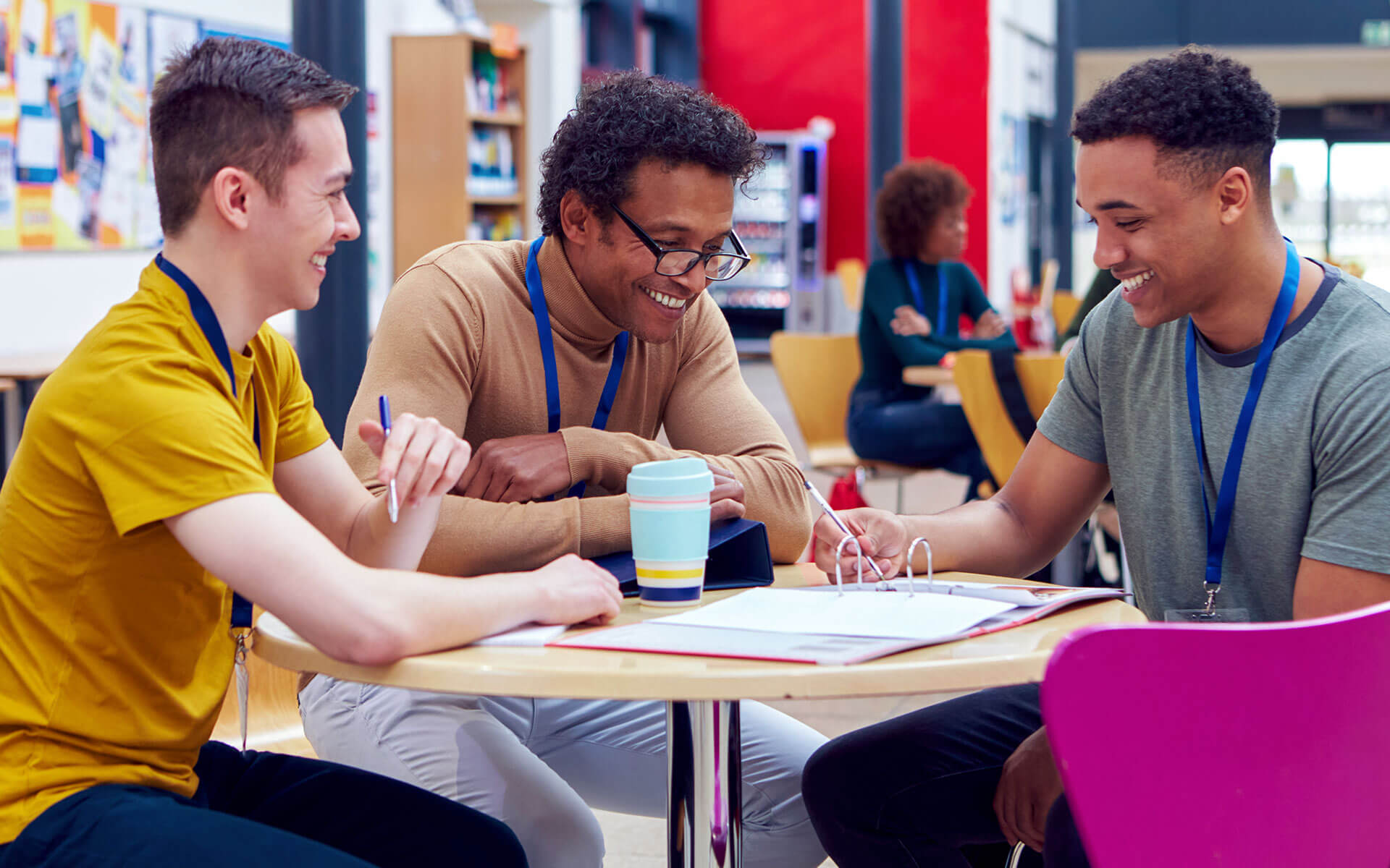 Group of colleagues sharing a laugh over a meal